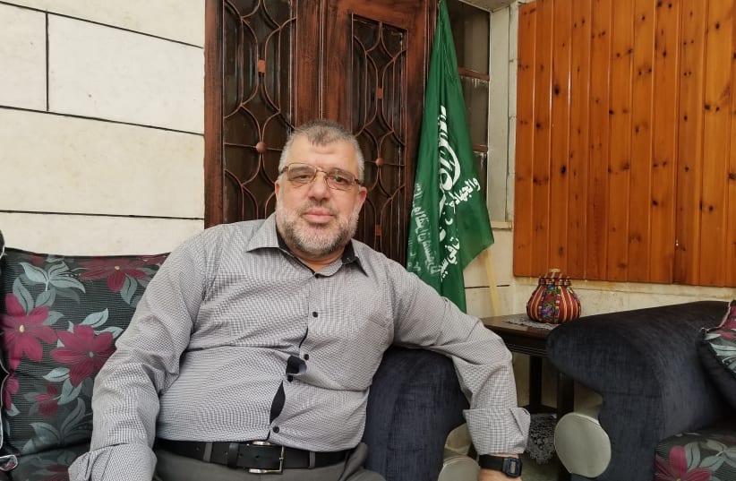 Hamas leader Hassan Yousif in his living room in Beitunia, a suburb of Ramallah, September 6, 2017. (photo credit: ADAM RASGON)