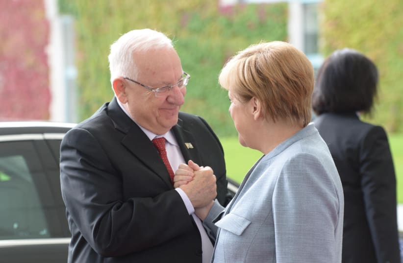 President Reuven Rivlin meets German Chancellor Angela Merkel in Germany (photo credit: AMOS BEN GERSHOM, GPO)