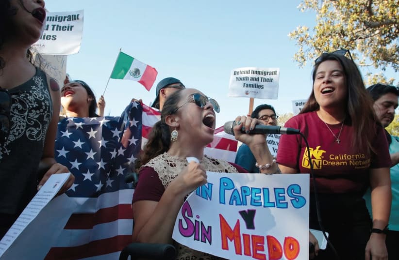 PAULINA RUIZ chants with supporters of the Deferred Action for Childhood Arrivals program on Olivera Street in Los Angeles, California, earlier this week. (photo credit: KYLE GRI/REUTERS)