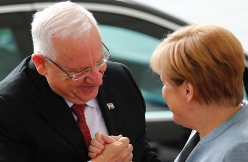 PRESIDENT REUVEN RIVLIN is greeted by German Chancellor Angela Merkel at the Chancellery in Berlin. (photo credit: REUTERS)