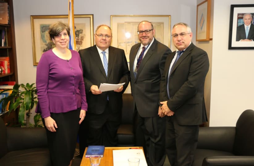 Rabbi Steven Wernick, CEO of USCJ (The United Synagogue of Conservative Judaism) and Rabbi Julie Schonfeld, CEO of the Rabbinical Assembly hand delivered an open letter addressed to Prime Minister Benjamin Netanyahu to  Dani Dayan, Consul General of Israel in New York, September 7, 2017. (photo credit: Courtesy)