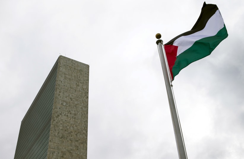 The Palestinian flag flies after being raised by Palestinian President Mahmoud Abbas in a ceremony at the United Nations General Assembly. (photo credit: REUTERS)