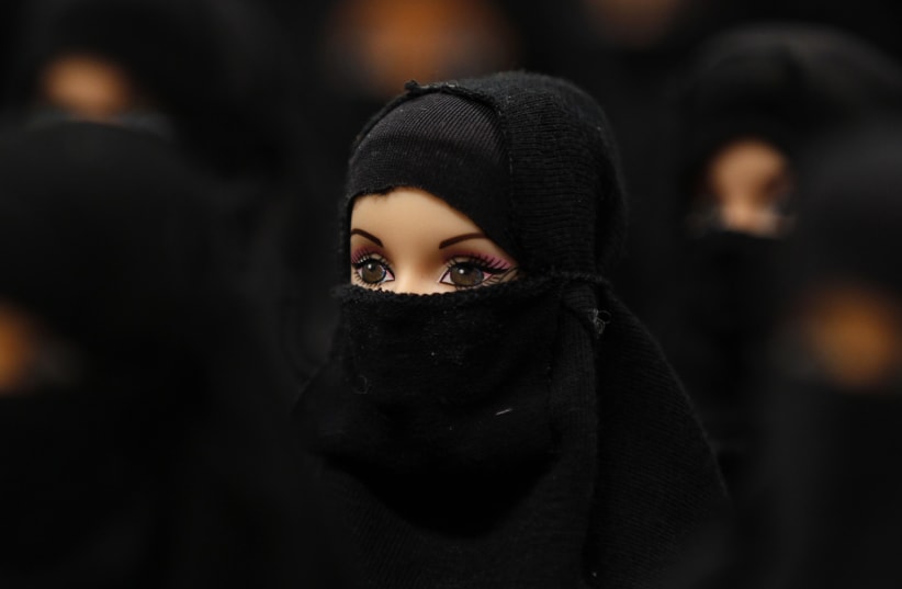 A German art installation showing 100 Barbie dolls with burkas, 2012 (photo credit: REUTERS/INA FASSBENDER)