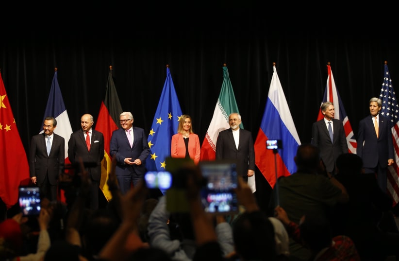 Representatives pose after Iran and six major world powers reached a nuclear deal, capping more than a decade of on-off negotiations, July 14, 2015 (photo credit: REUTERS)