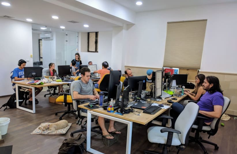 EMPLOYEES AT the 200 Apps smartphone and web application developer work in their new office in Jerusalem’s German Colony neighborhood (photo credit: Courtesy)