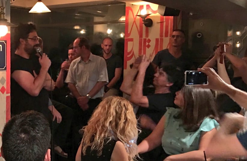 Lior Meiri (far left) speaking at a Tel Aviv bar at a New Likudniks event in September 2017. (photo credit: Lahav Harkov)