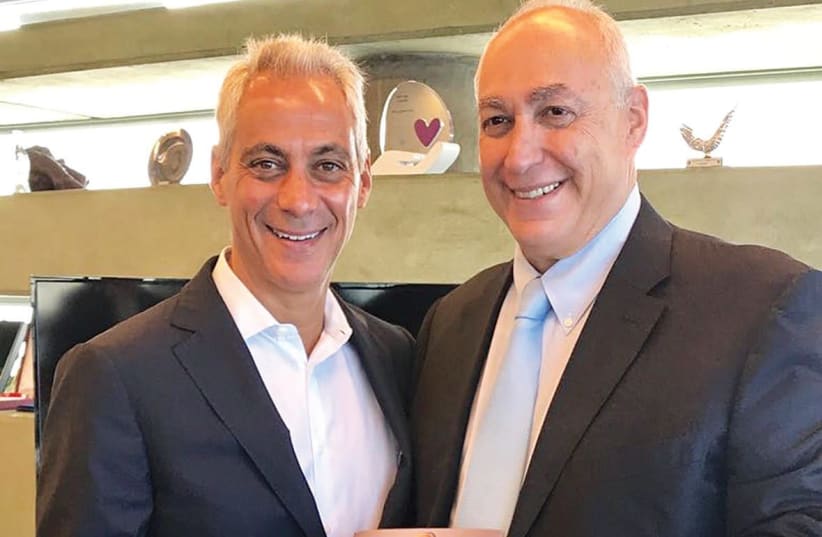 Chemi Peres and Chicago Mayor Rahm Emmanuel display a copy of Shimon Peres' autobiography  (photo credit: Courtesy)