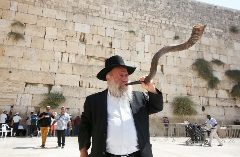 Man blowing the shofar at the Western Wall before Rosh Hashana (photo credit: MARC ISRAEL SELLEM)
