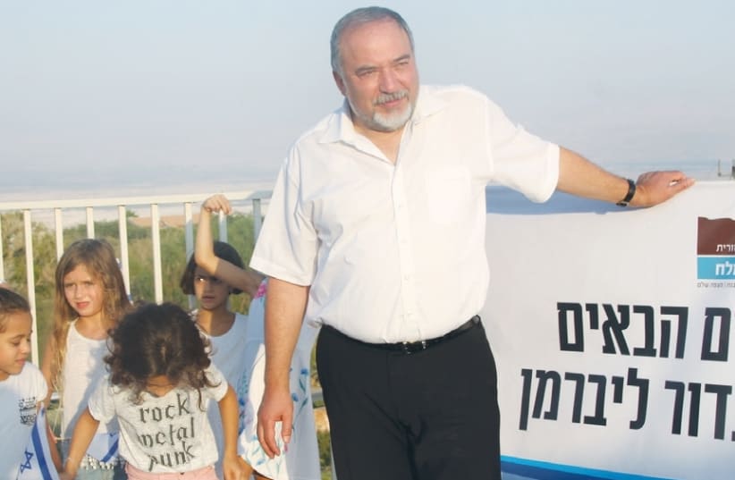 DEFENSE MINISTER Avigdor Liberman participates in a Rosh Hashana toast yesterday in the West Bank settlement of Vered Yeriho. (photo credit: TOVAH LAZAROFF)