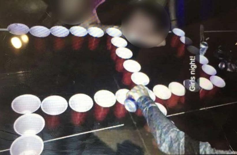 This photo of a swastika made up beer pong cups has been altered to not reveal the St. Teresa’s Academy girls involved. (photo credit: KANSAS CITY STAR/TRIBUNE NEWS SERVICE)