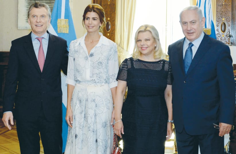 Benjamin Netanyahu (right) stands next to his wife, Sara, along with Argentinian President Mauricio Macri and First Lady Juliana Awada during a meeting on September 12 at the presidential palace in Buenos Aires.  (photo credit: ARGENTINE PRESIDENCY/REUTERS)