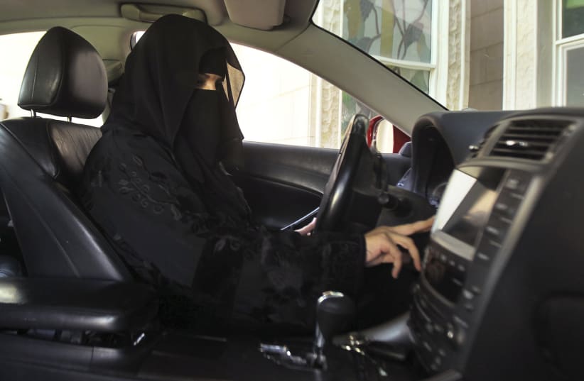 Despite being barred from driving, a woman drives a car in Saudi Arabia, October 22, 2013. (photo credit: REUTERS)