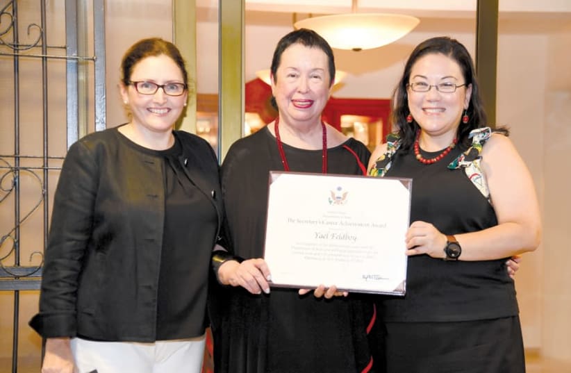 YAEL FELDBOY, flanked by US Embassy spokeswoman Valerie O’Brien (left) and deputy chief of mission Leslie Tsou, displays the Secretary of State’s Career Achievement Award in recognition of her distinguished service. (photo credit: US EMBASSY)