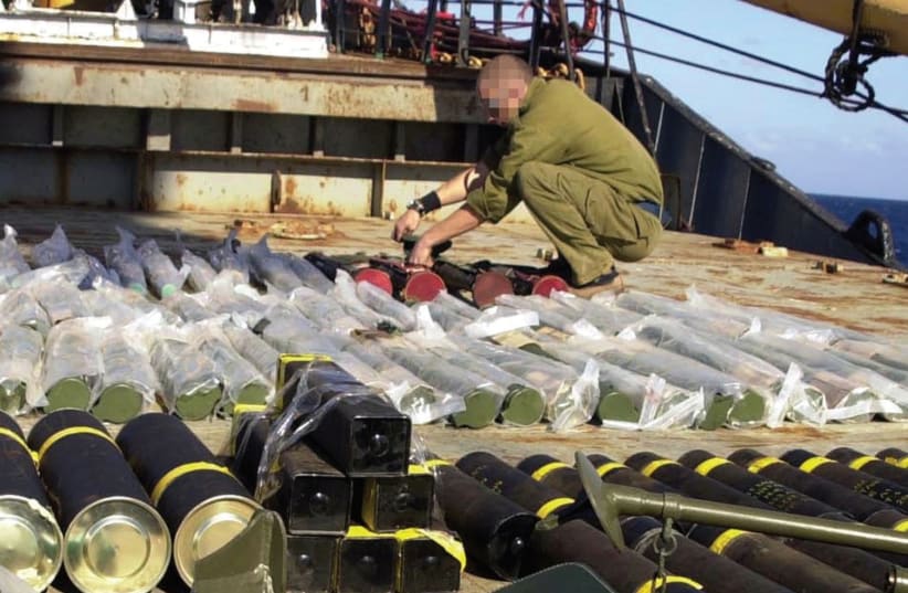 WEAPONS CONFISCATED aboard the Karine A, a ship laden with weapons destined for the Palestinians but intercepted by Israeli forces in January 2002, are displayed on the deck of the vessel. (photo credit: REUTERS)
