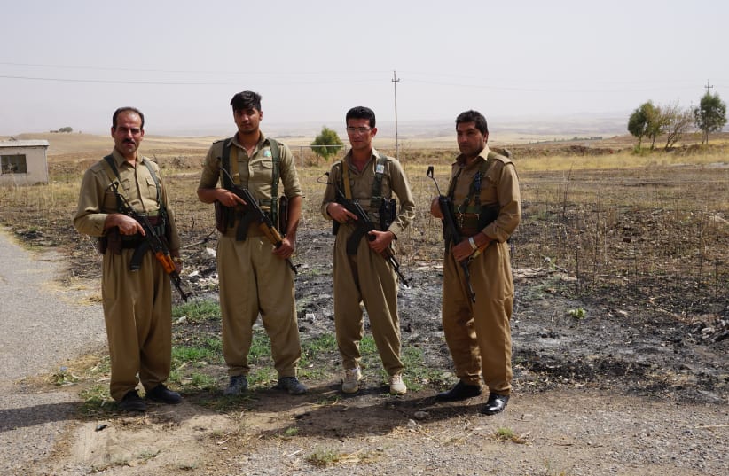 Peshmerga from the Democratic Party of Iranian Kurdistan stand for a photo at a secret location (photo credit: SETH J. FRANTZMAN)