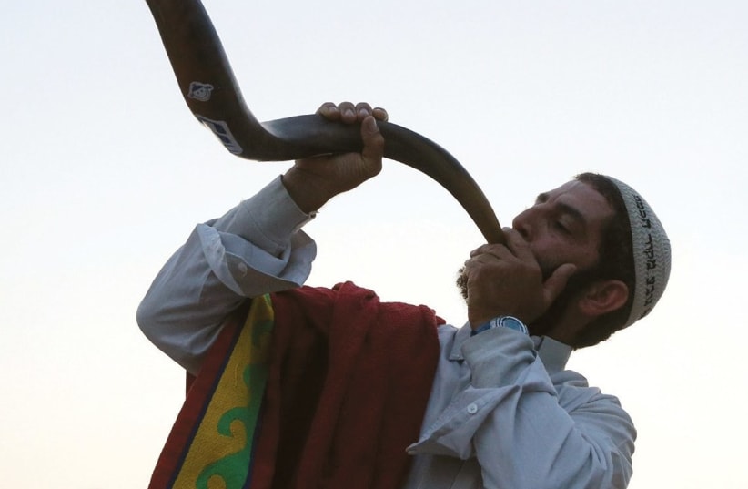 A Jewish man blowing the shofar.  (photo credit: REUTERS)