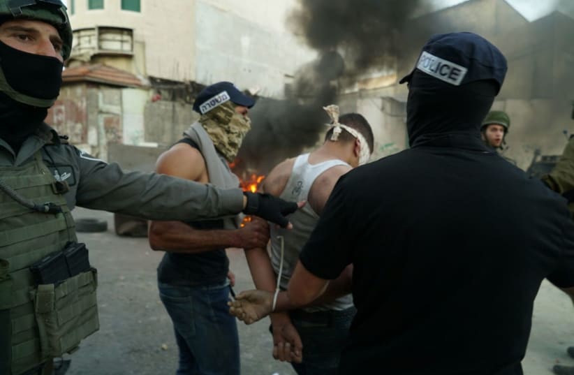 Border Police arrest Palestinians rioting in the West Bank village of Biddu, September 2017 (photo credit: POLICE SPOKESPERSON'S UNIT)