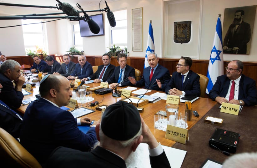 Israeli Prime Minister Benjamin Netanyahu (3rd R) attends the weekly cabinet meeting at his office in Jerusalem October 1, 2017. (photo credit: REUTERS)