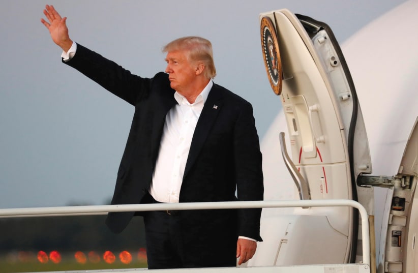 US PRESIDENT Donald Trump waves from Air Force One as he departs Morristown, New Jersey.  (photo credit: REUTERS)