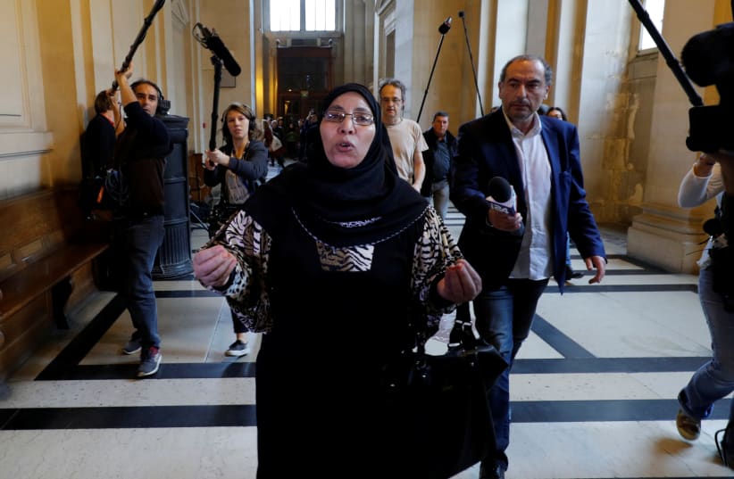 Zoulikha Aziri, the mother of gunman Islamist militant Mohammed Merah, who killed 7 people in 2012, leaves during the trial of her son Abdelkader Merah, who stands accused of complicity in the series of shootings committed by his brother, at the courthouse in Paris, France, October 2, 2017. (photo credit: REUTERS)
