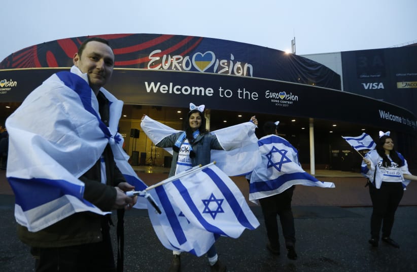 Israel's fans wave flags before the Eurovision Song Contest 2017 Grand Final at the International Exhibition Centre in Kiev, Ukraine, May 13, 2017. (photo credit: REUTERS)