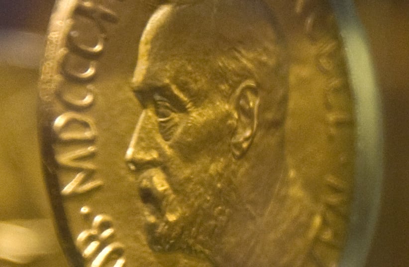 An 18-carat gold Nobel Peace Prize medal, awarded in 1921 to Norway's Christian L. Lange, is seen in an exhibition at the Nobel Peace Centre in Oslo December 9, 2009. (photo credit: REUTERS)