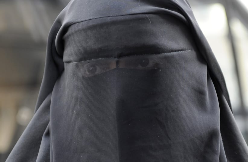 A woman who identified herself as Nayet, wearing a burqa, is seen after her release from a police station in Paris April 11, 2011. (photo credit: REUTERS)