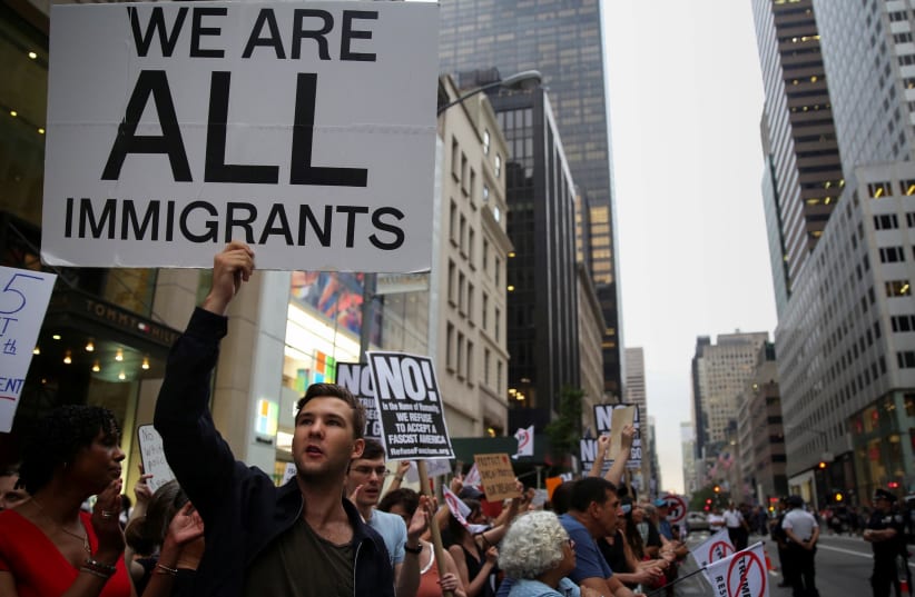 A protest against Trump's immigration policies outside Trump Tower, Manhattan, August 2017 (photo credit: REUTERS/AMR ALFIKY)