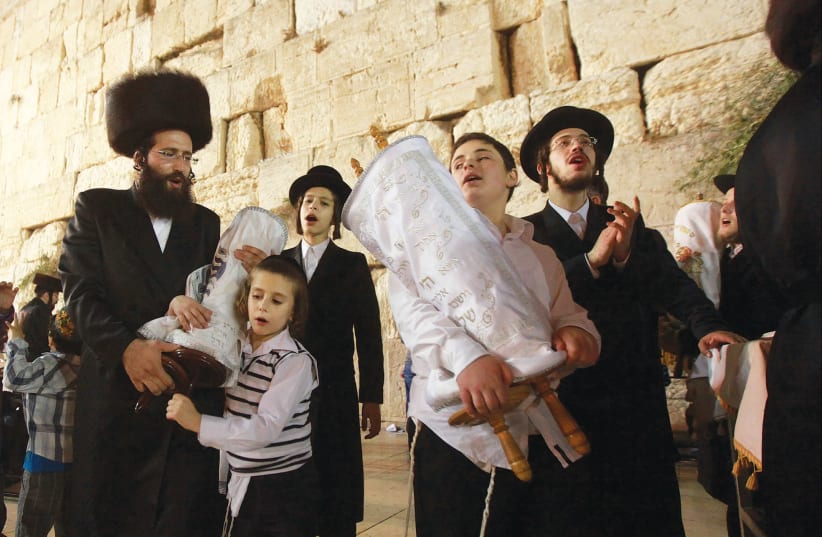 Celebrating Simhat Torah at the Western Wall. (photo credit: MARC ISRAEL SELLEM/THE JERUSALEM POST)