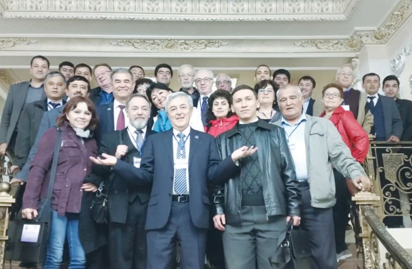 Participants in the Scientific Conference at the National University of Uzbekistan pose with Holon Institute of Technology President Eduard Yakubov (center) (photo credit: TATIANA SHOIKHET)