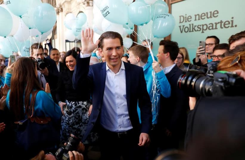 Top candidate of Peoples Party (OeVP) and Foreign Minister Sebastan Kurz arrives in front of his party's headquarters in Vienna, Austria October 13, 2017.  (photo credit: LEONHARD FOEGER / REUTERS)
