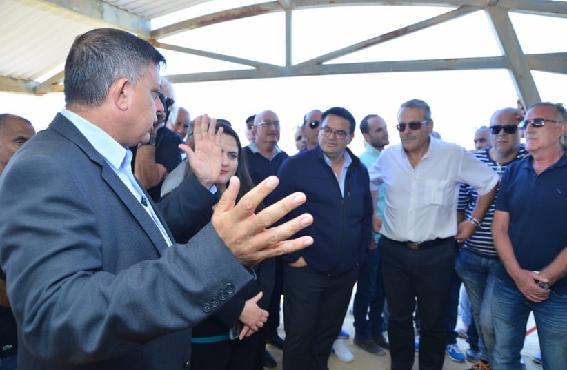 Opposition leader and Labor party head Avi Gabbay (left) meets with Negev Ceramics workers and the mayor on Sunday in Yeroham. (photo credit: COURTESY OF AVI GABBAY)