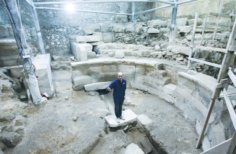 JOE UZIEL stands yesterday in the Roman theater uncovered during excavations of the Western Wall tunnels in Jerusalem. (photo credit: Israel Antiquities Authority)