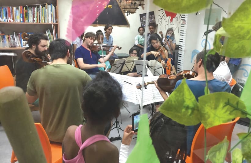 MUSETHICA MUSICIANS play in front of a group of children in Israel. (photo credit: ZVIKA ZOREF)