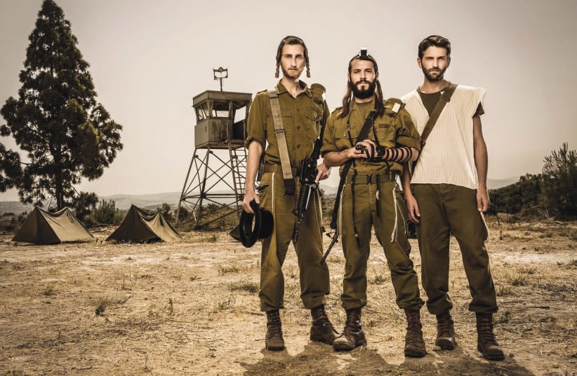 The protagonists of ‘Kippat Barzel,’ playing infantrymen in the Netzah Yehuda Battalion, pose at their base. (photo credit: ODED KARNI)