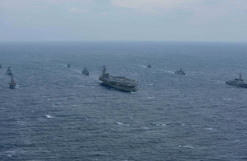 The aircraft carrier USS Ronald Reagan and the Arleigh Burke-class destroyer USS Stethem are underway alongside ships from the Republic of Korea (ROK) Navy in the waters east of the Korean Peninsula Wednesday. (photo credit: REUTERS)