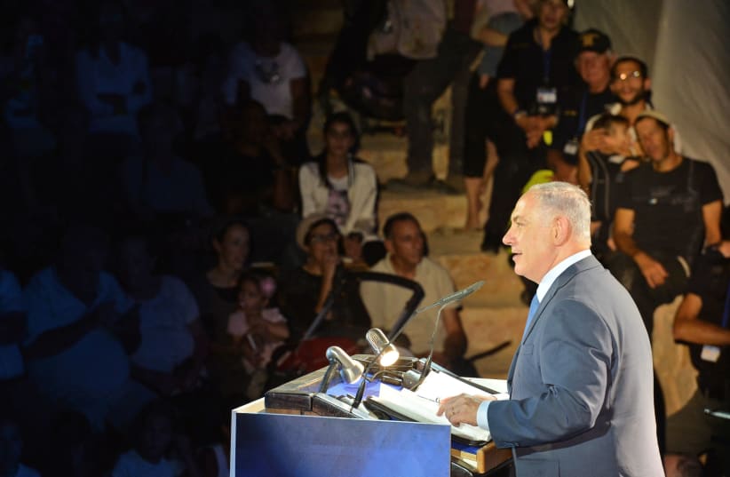 Prime  Minister Benjamin Netanyahu delivers a speech marking 50 years of Israeli presence in the Jordan Valley  (photo credit: KOBI GIDEON/GPO)