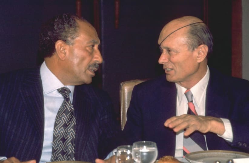 Sadat chatting with foreign minister Moshe Dayan during a dinner at the King David Hotel (photo credit: YAACOV SAAR/GPO)