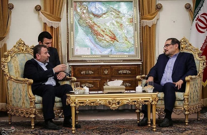 Saleh al-Arouri (L), Hamas deputy chief, meets with Ali Shamkhani, secretary of Iran's National Security Council, in Tehran, Iran October 21, 2017.  (photo credit: TASNIM NEWS AGENCY/HANDOUT VIA REUTERS)