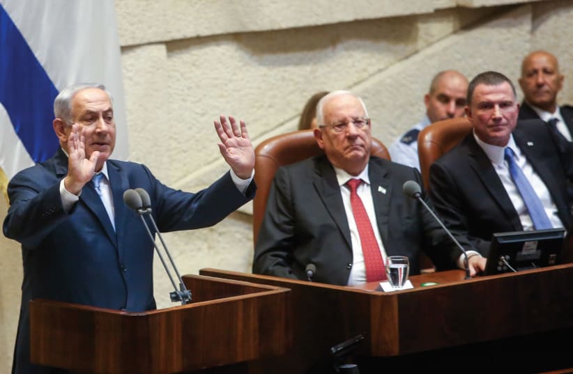 Prime Minister Benjamin Netanyahu delivers a speech at the Knesset Monday. (photo credit: MARC ISRAEL SELLEM)