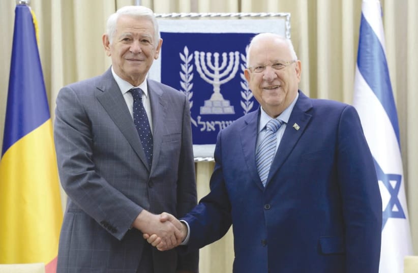 President Reuven Rivlin (right) receives Romanian Foreign Minister Teodor Melescanu at the President’s Residence yesterday. (photo credit: Mark Neiman/GPO)