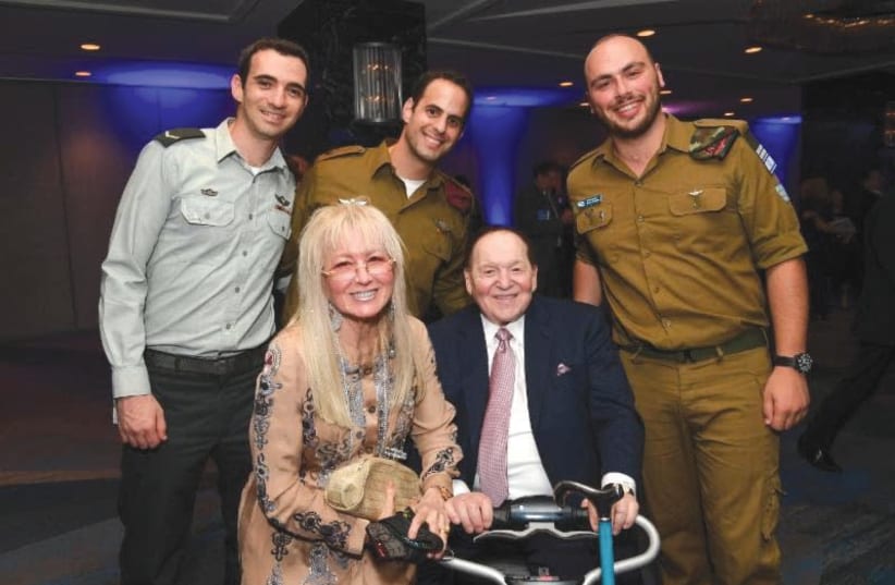 MIRIAM AND Sheldon Adelson pose with IDF soldiers in New York. (photo credit: SHAHAR AZRAN)