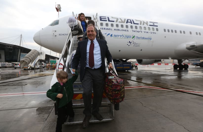 Rabbi Yechiel Eckstein, founder of the International Fellowship of Christians and Jews, disembarks a plane bringing olim from Ukraine (photo credit: MARC ISRAEL SELLEM)