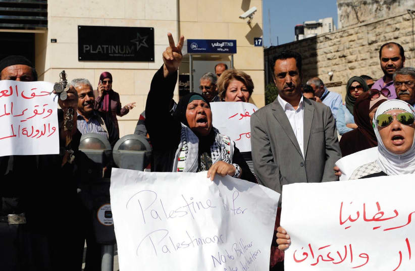PALESTINIANS PROTEST the Balfour Declaration in Ramallah last week.  (photo credit: MOHAMAD TOROKMAN/REUTERS)