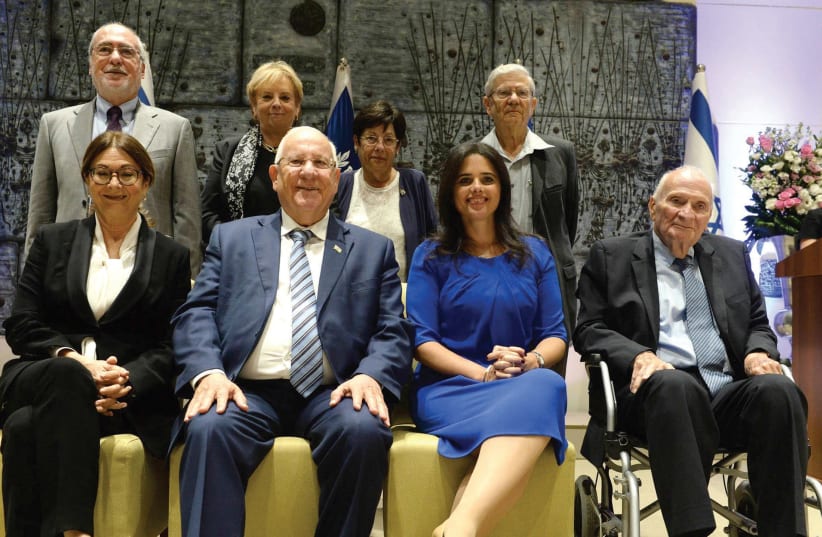 INCOMING SUPREME COURT President Esther Hayut (lower-left) poses yesterday with President Reuven Rivlin (photo credit: MARK NEYMAN / GPO)