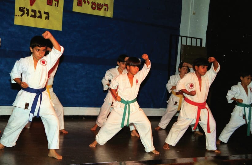 CHILDREN PRACTICE karate in Lod. (photo credit: Wikimedia Commons)