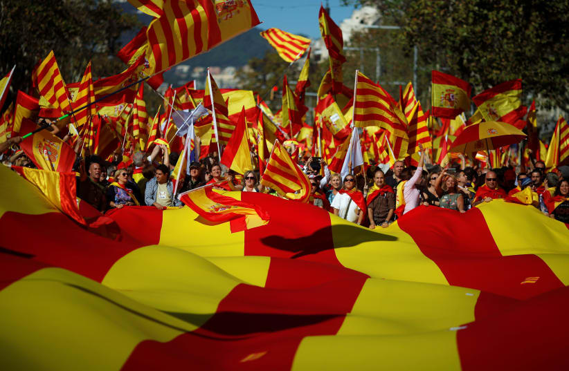 Pro-unity supporters take part in a demonstration in central Barcelona, Spain (photo credit: JON NAZCA/ REUTERS)