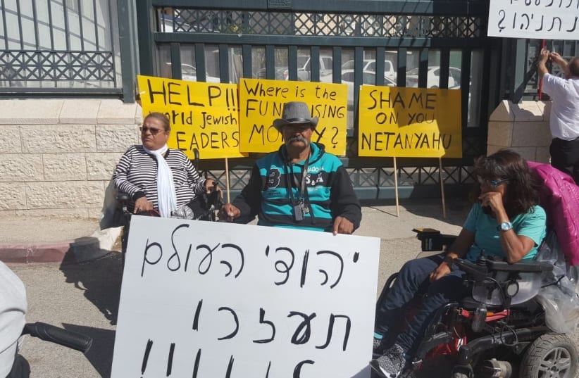 Protesters with disabilities call on the Jews of the world to help during a rally outside the Prime Minister's Office (photo credit: COURTESY OF DISABLED STRUGGLE CAMPAIGN)