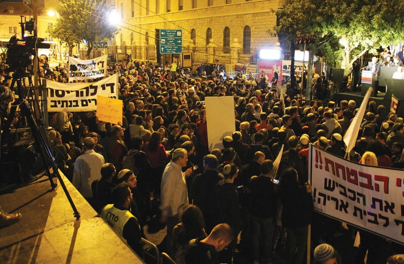 POLITICIANS AND protesters hold a rally in front of Prime Minister Benjamin Netanyahu’s Jerusalem home last night calling on him to authorize money that was promised for security to prevent further terrorist attacks. (photo credit: TOVAH LAZAROFF)