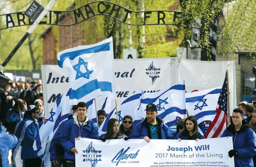 March of the Living particpants outside the gates of Auschwitz (photo credit: AGENJCA GAZETA/ REUTERS)